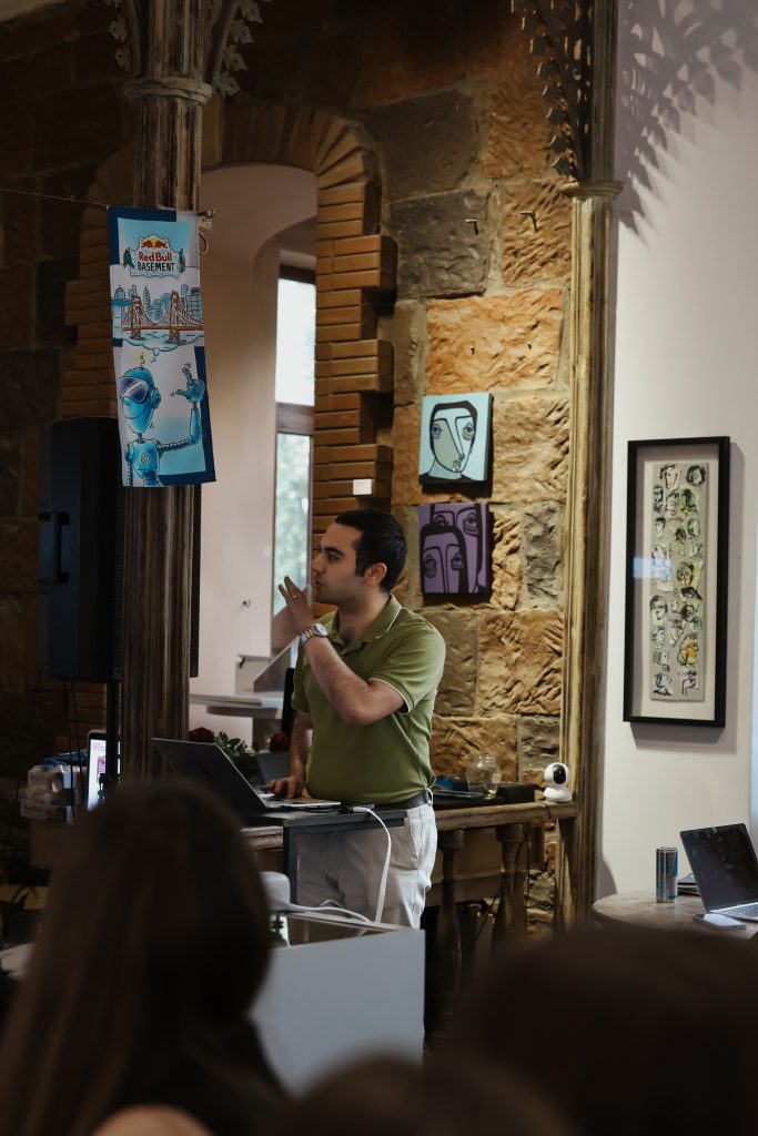 Arayik Grigorian pitching the AI legal-tech models during the digital resilience hackathon.