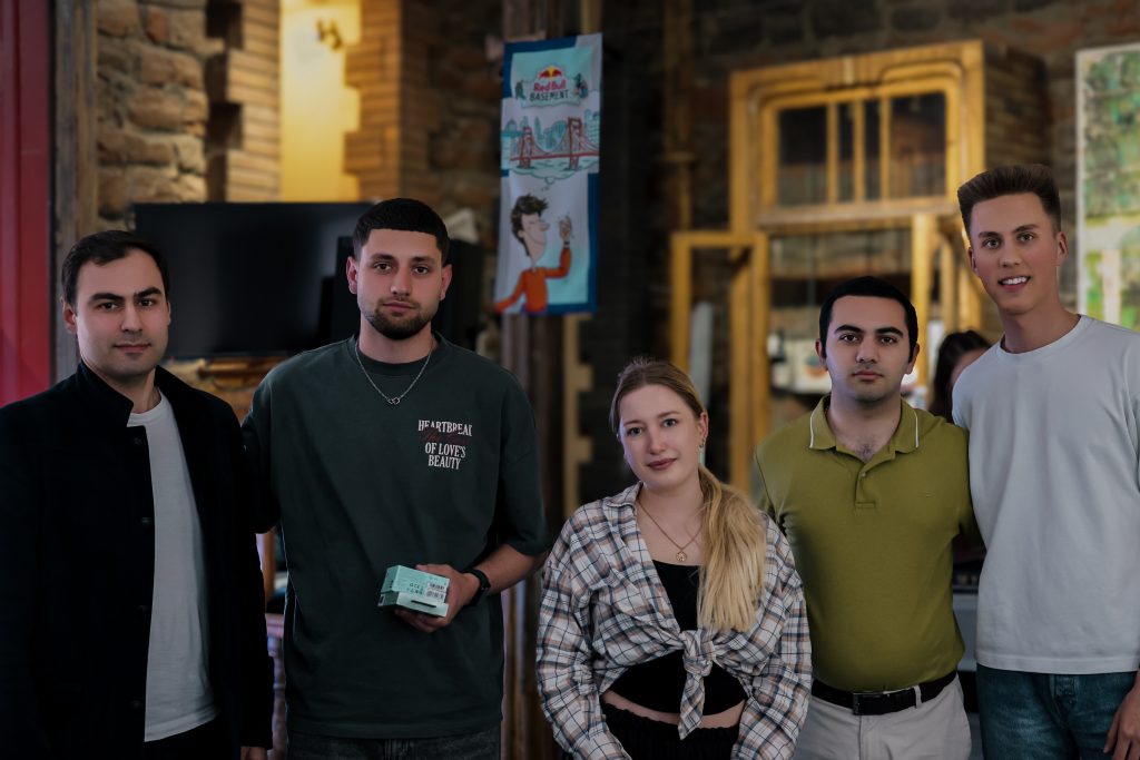 The Themis Labs team holding their hackathon awards after successfully building innovative AI web prototypes.