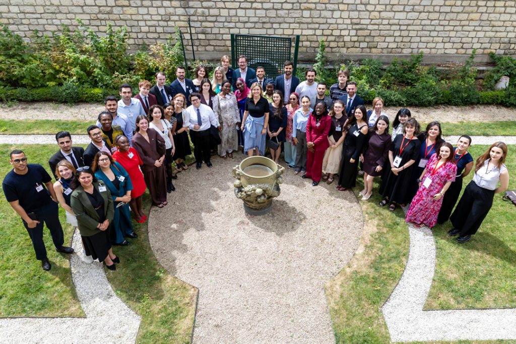 Youth ambassadors and delegates gathered in the courtyard at the World Congress Against the Death Penalty